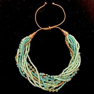 Multi Strand Green and Gold Bead Bracelet with Adjustable Pull Clasp
